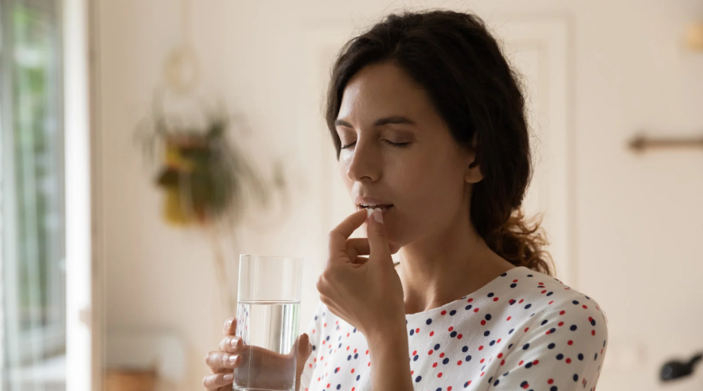 woman about to take medication to ease depression