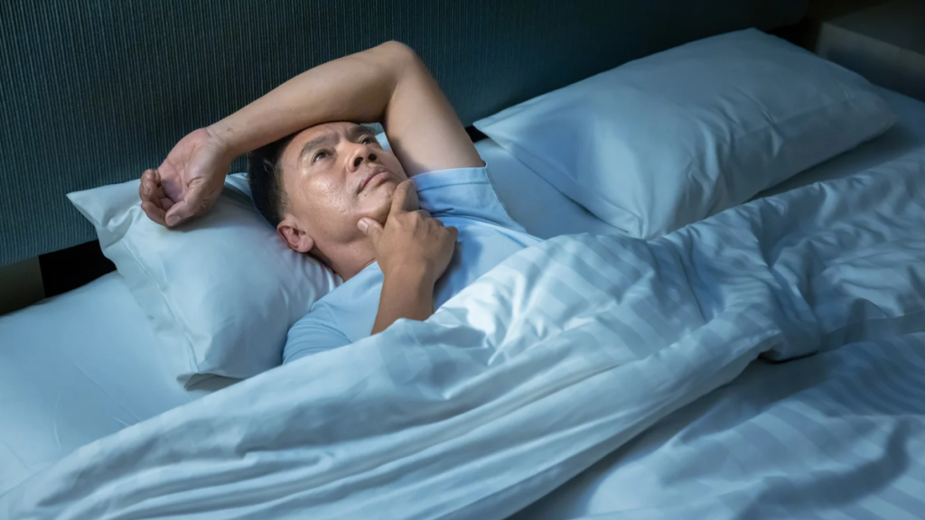 man cannot sleep due to insomnia